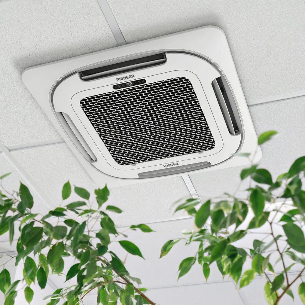 Pioneer ceiling-mounted cassette air conditioning unit with white finish and black mesh filter grille